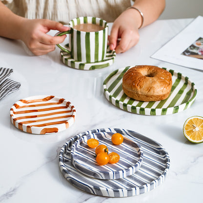 A ceramic coffee cup and saucer set