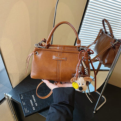 A handbag messenger bag