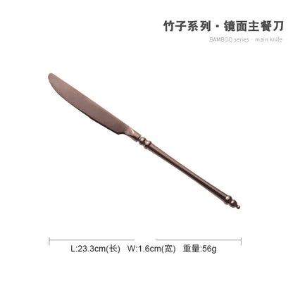 A stainless steel knife and fork set