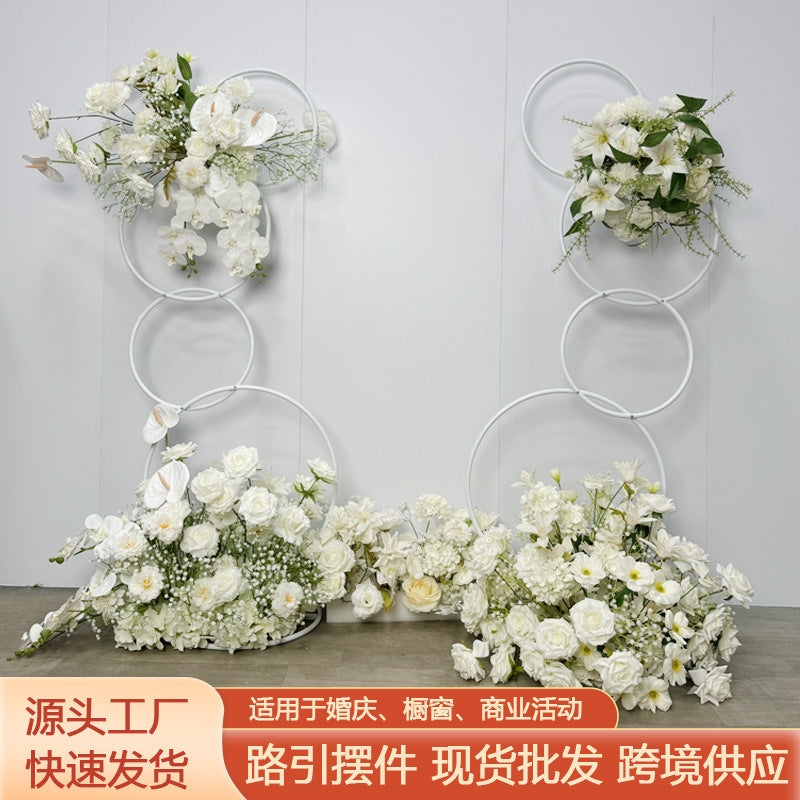 A wrought iron flower stand road guide