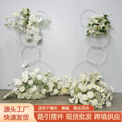 A wrought iron flower stand road guide