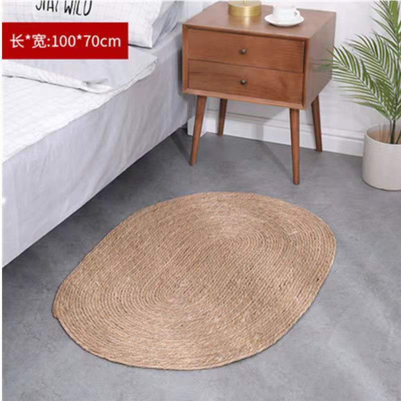 A handmade grass rattan woven carpet floor mat