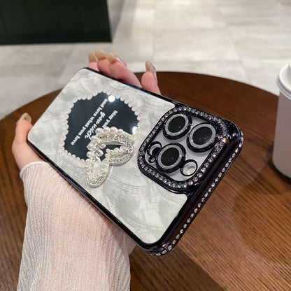 A three-dimensional pearl love mirror mobile phone case
