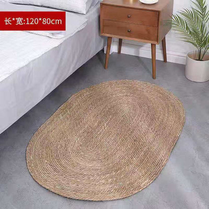 A handmade grass rattan woven carpet floor mat