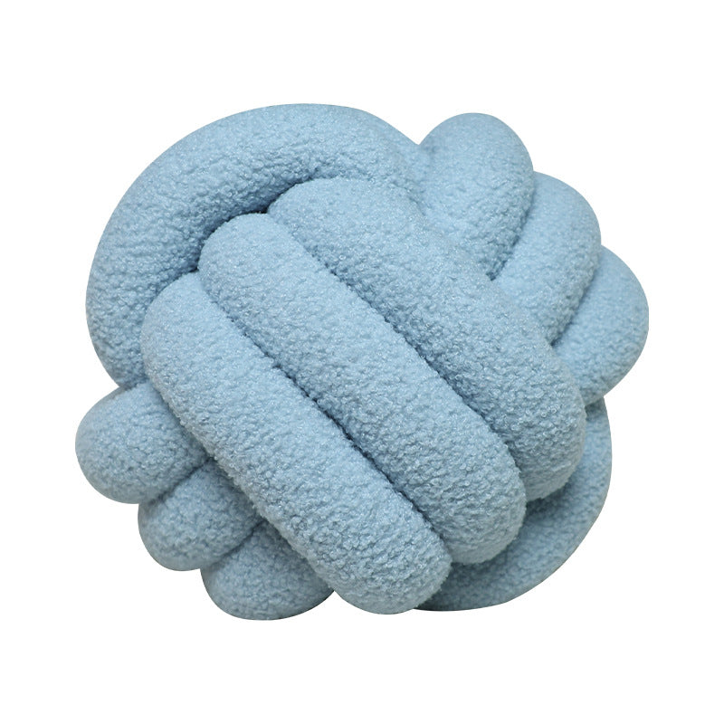 A braided knotted ball pillow