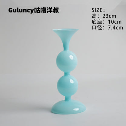 A vintage French Roman column glass candle holder