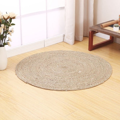 A handmade grass rattan woven carpet floor mat