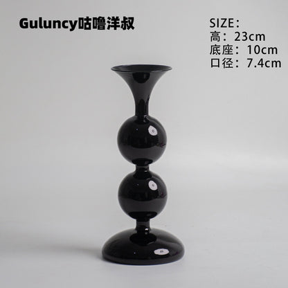 A vintage French Roman column glass candle holder