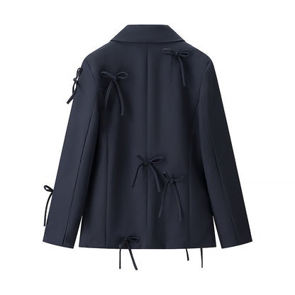 A bow-embellished blazer