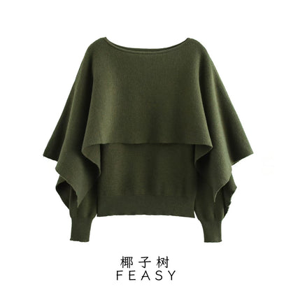 A cape knitted sweater