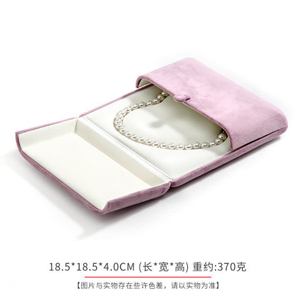 A heart shaped pearl necklace box