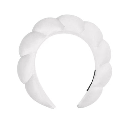 A towel fleece sponge twist headband