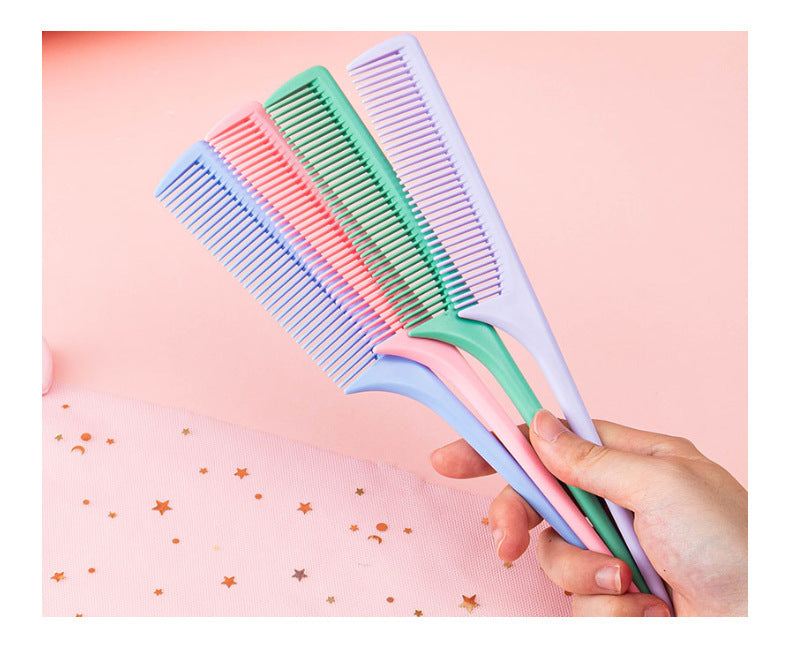 A plastic comb with a pointed tail