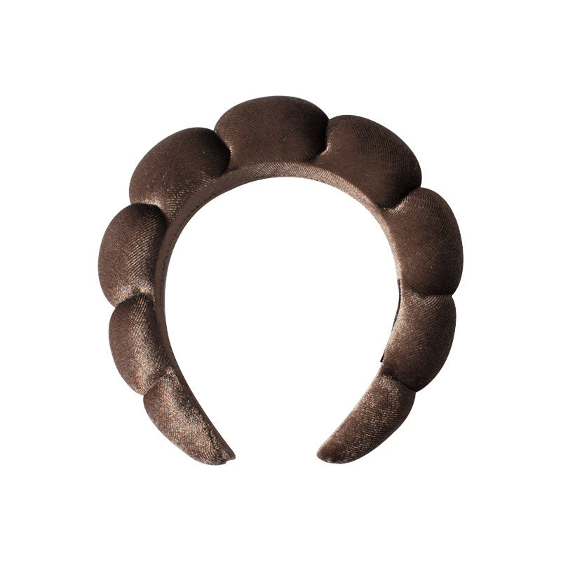 A towel fleece sponge twist headband