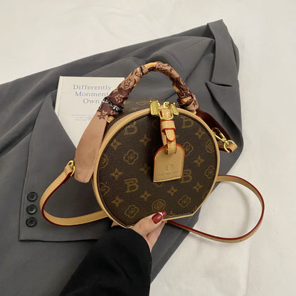 A new high-end printed apple bag niche light luxury fashion versatile shoulder messenger bag portable round cake bag