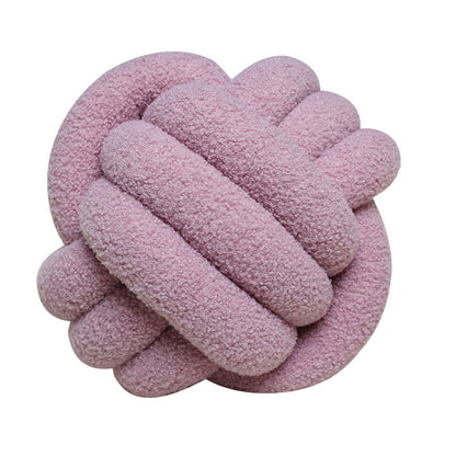 A braided knotted ball pillow