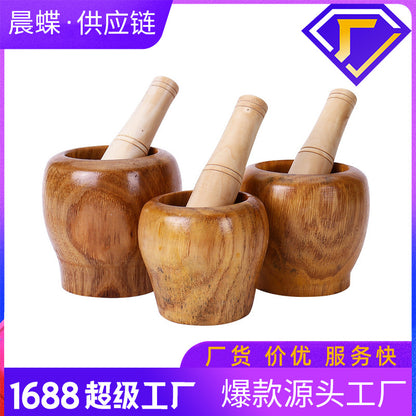 A Solid wood garlic tamper, medicine jar, wooden cup garlic puree