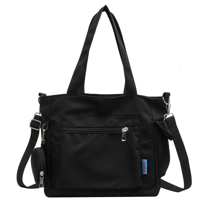 A new solid color canvas bag women's large-capacity shoulder bag student versatile tote bag hand bag messenger cloth bag