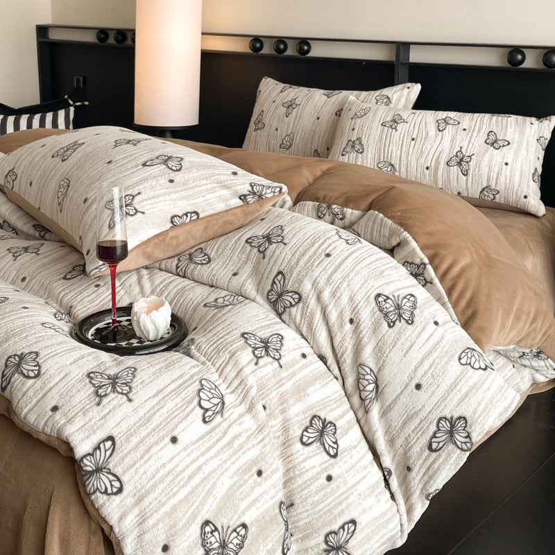 A four-piece quilt cover on the bed