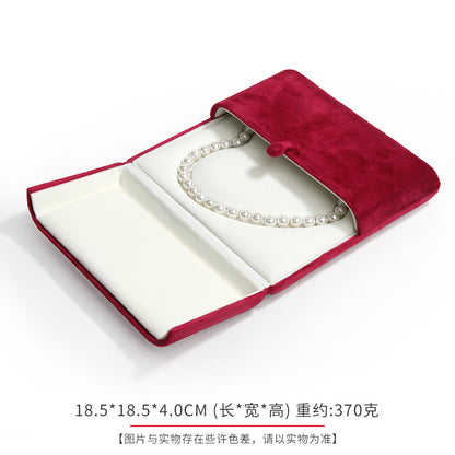 A heart shaped pearl necklace box