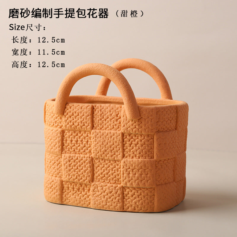 A ceramic handbag vase ornament
