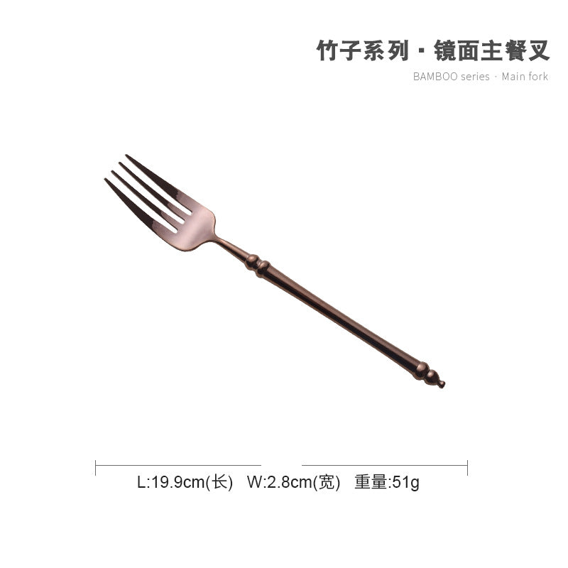 A stainless steel knife and fork set