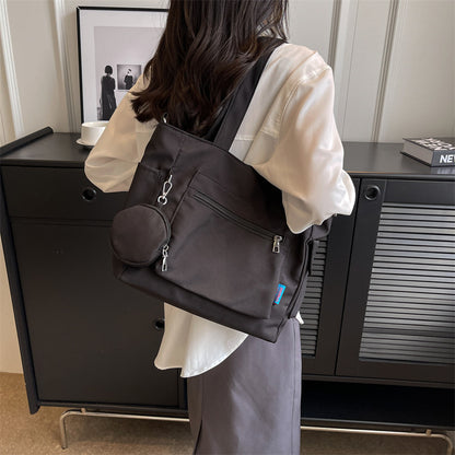 A new solid color canvas bag women's large-capacity shoulder bag student versatile tote bag hand bag messenger cloth bag